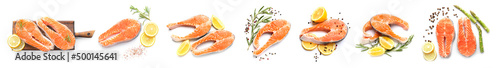 Set of raw salmon steaks with spices and lemons on white background, top view