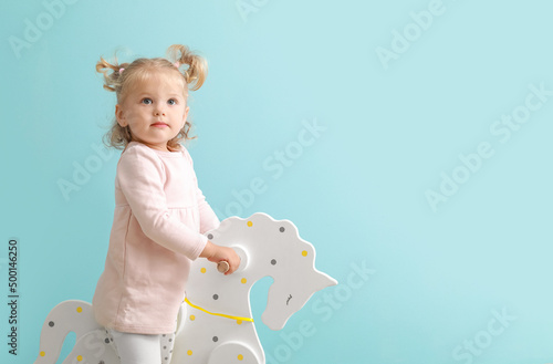 Adorable baby girl with roc...
