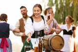 Drunk people celebrating Octoberfest outdoors