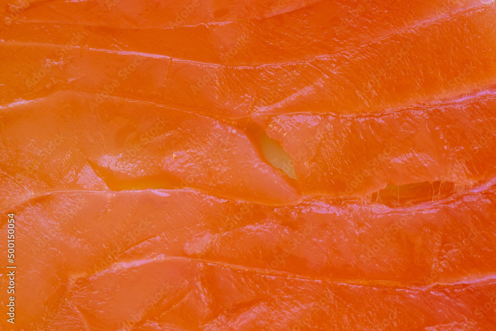 Orange raw salmon as artistic background.