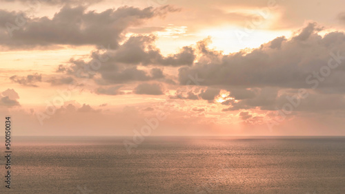 landscape scenery of sea with cloudy sky during sunsey or sunrise