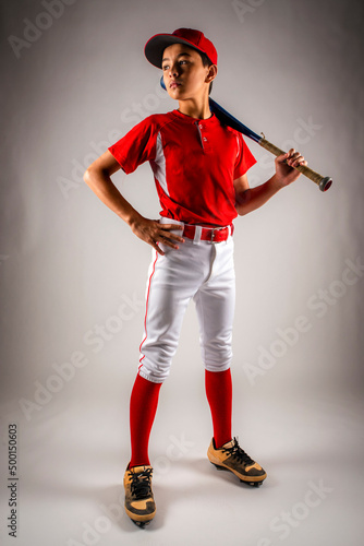 Photography Male youth baseball player standing proudly with bat