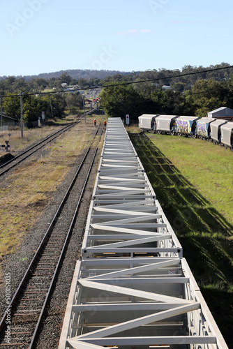 Railway yard and station in the Queensland town of Warwick in Southern Downs Region, featuring buildings, silos and carriages