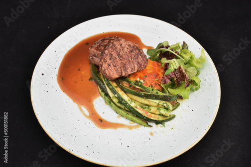 spicy steak with avocado and salad