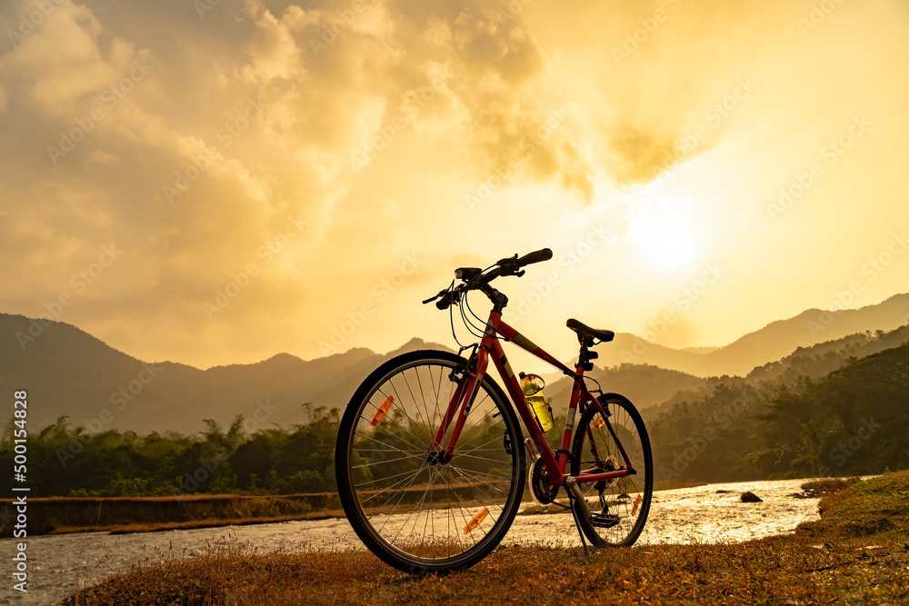 A bicycle is parked in the beautiful scenery.