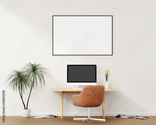 Blank computer screen and various items on desktop workspace with picture frame in home office room. 3D renering illustration. photo