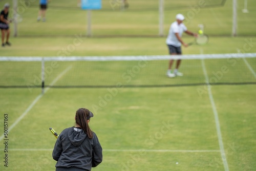 Amateur playing tennis at a tournament and match on grass in Melbourne, Australia  © William