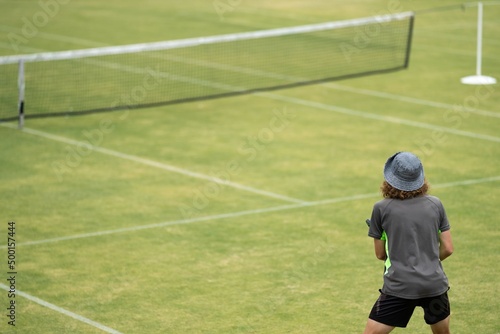 Amateur playing tennis at a tournament and match on grass in Melbourne, Australia  © William