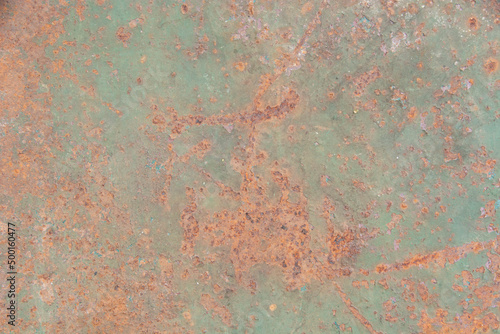 Its metal plate is rusty green. © Thachakrit