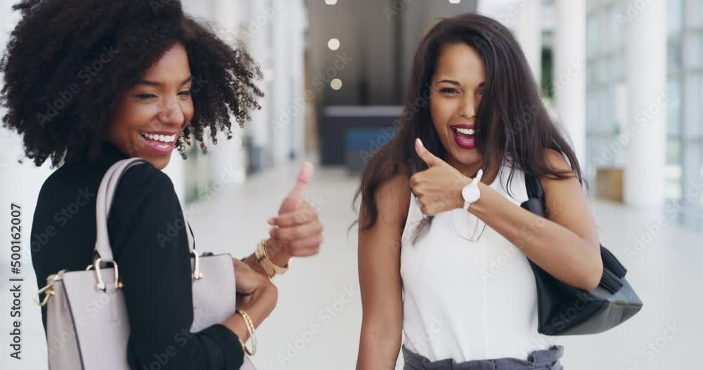 Keep positivity on your side. Two beautiful young business women ...