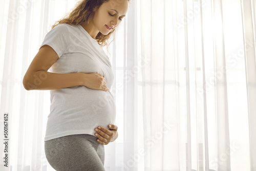 Happy young Caucasian woman touch caress big belly excited with last months of pregnancy. Smiling healthy pregnant female await expect baby born. Childbirth and motherhood concept. Free Download Happy young Caucasian woman touch caress big belly excited with last months of pregnancy. Smiling healthy pregnant female await expect baby born. Childbirth and motherhood concept. - GFXLoad