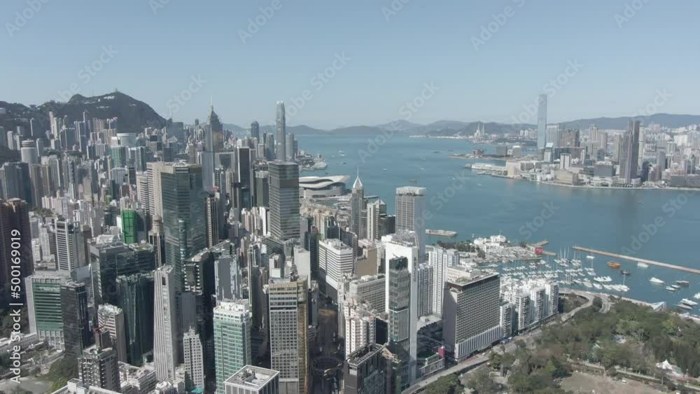Aerial view of Hong Kong bay and skyscrapers on a beautiful day. Aerial view of Hong Kong bay and skyscrapers on a beautiful day.
