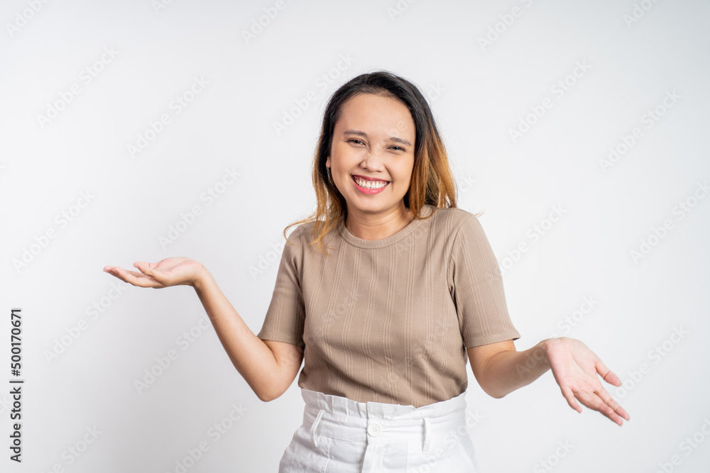 excited asian woman with two hands palm up on isolated background excited asian woman with two hands palm up on isolated background