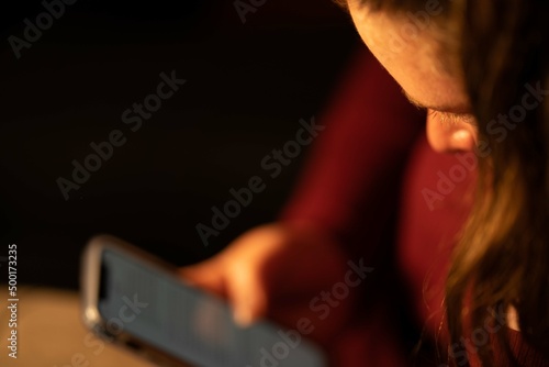 Girl in her phone at night