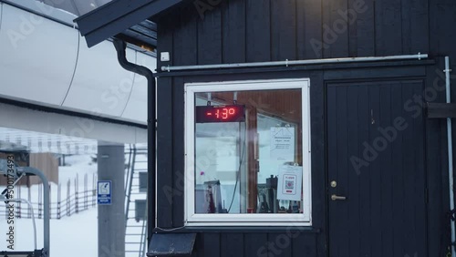 Sign at ski resort showing -13 degrees celcius temperature on a cold winter morning in Norway photo