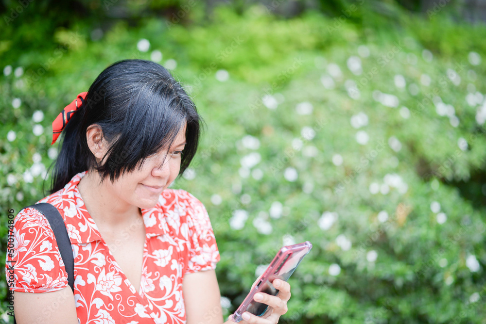 Asian woman traveling city park with happy smile Asian woman traveling city park with happy smile
