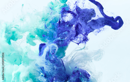 Paint splash in water. Acrylic ink drop background. Abstract colors swirl texture