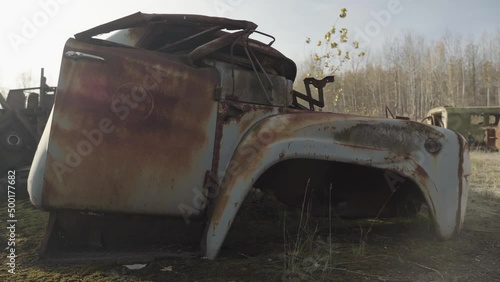 Abandoned rusty radioactive equipment of the soviet union. Cemetery of technology in Rassokha. Chernobyl. Ukraine photo