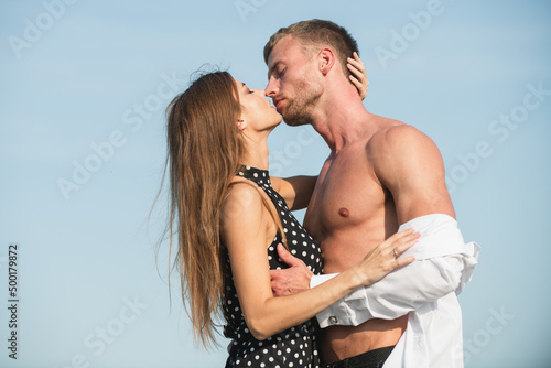 Romantic young couple kissing outdoor. Romantic and love concepr. Lovely happy couple kiss and hugs. Couple in love kiss. photo