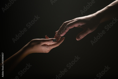 Hands at the time of rescue. Friendly handshake, friends greeting, teamwork, friendship. Tenderness, tendet touch.