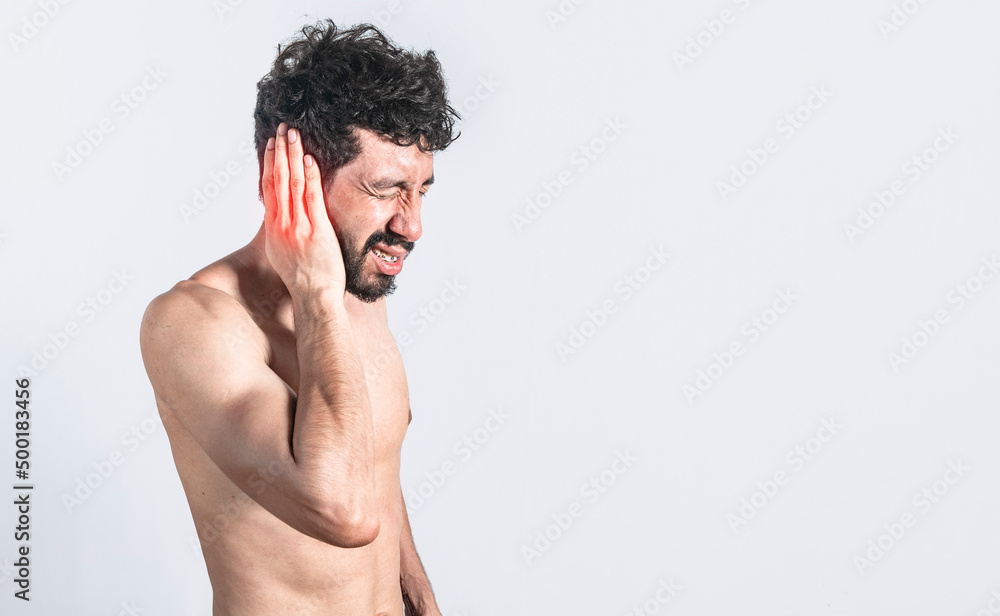 Fototapeta premium Person with earache on isolated background, man with earache on isolated background, ear disease concept