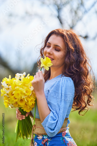 portrait of a beautiful brunette woman in spring nature.