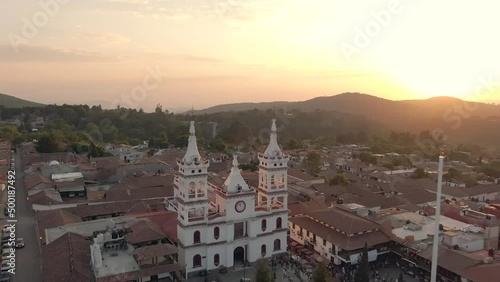 Stunning Sunset Over Downtown Mazamitla In Jalisco, Mexico With San Cristobal Parish In View. drone shot photo