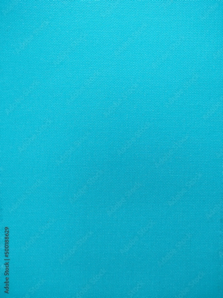 Texture canvas painted light blue background, surface canvas painted light blue as background. Texture canvas painted light blue background, surface canvas painted light blue as background.