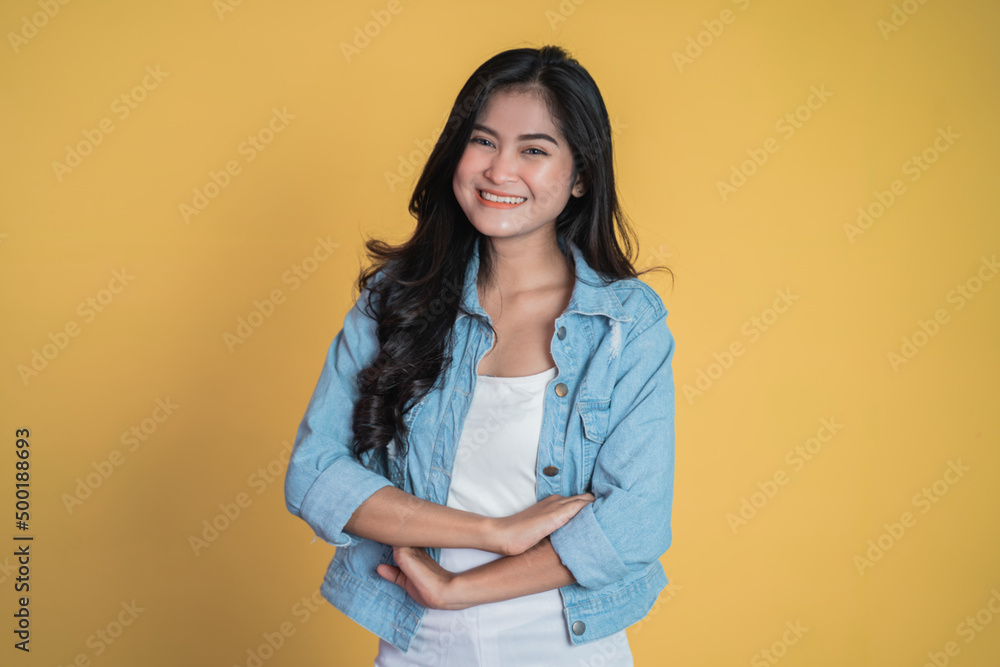young asian woman stand with crossed hands on isolated background young asian woman stand with crossed hands on isolated background
