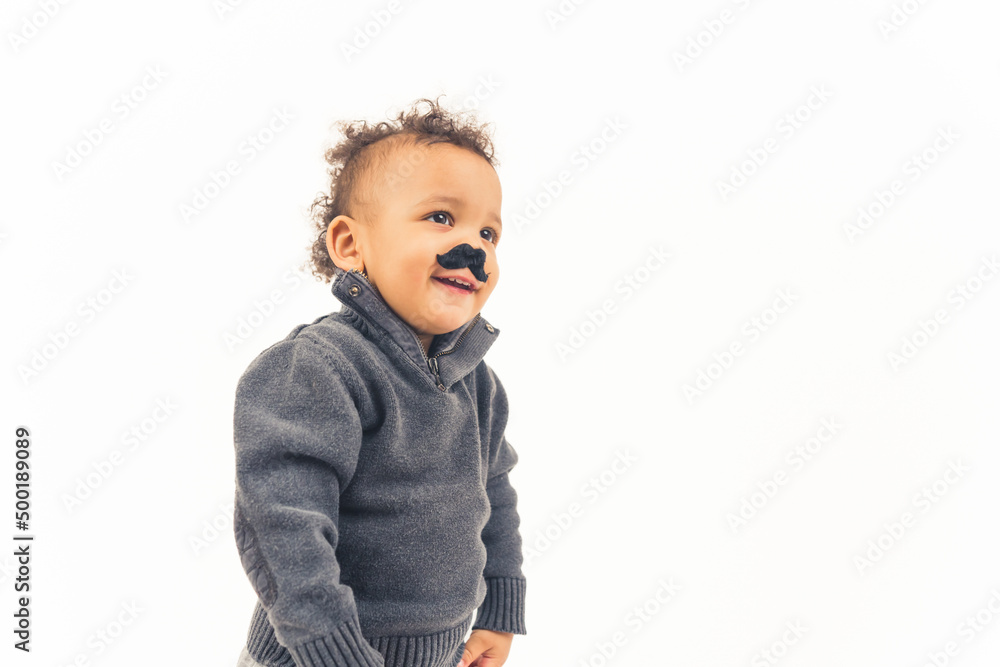 smiling little schild with fake mustache is rejoicing, medium shot on the white background. High quality photo smiling little schild with fake mustache is rejoicing, medium shot on the white background. High quality photo
