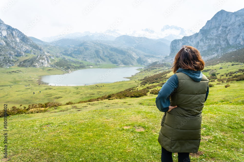 A young tourist enjoying the views at the Entrelagos viewpoint of Lake Ercina in the Lakes of Covadonga. Asturias. Spain