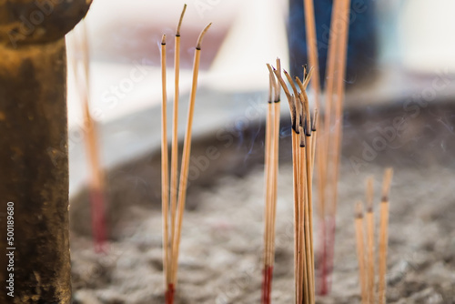Фотография Burning incense sticks with white smoke on Incense burner,Incense smoke,Buddhism