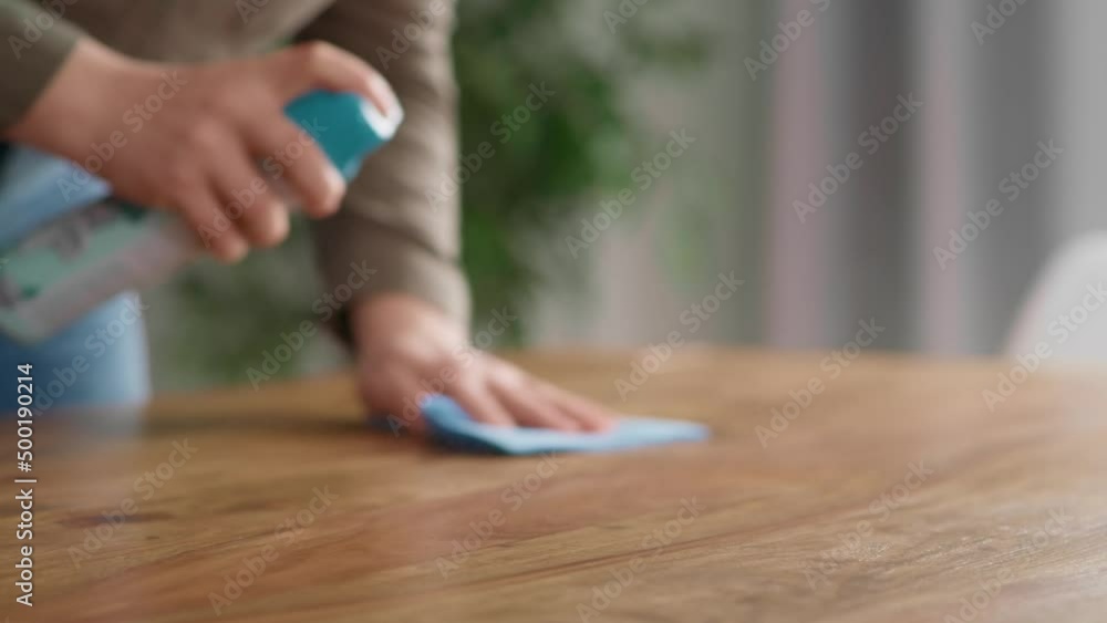 Close up of caucasian woman cleaning table at home. Shot with RED helium camera in 8K. Close up of caucasian woman cleaning table at home. Shot with RED helium camera in 8K.
