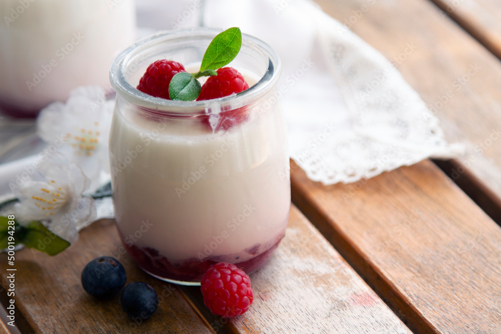 Yogurt with Fresh Berries on Woden Table Yogurt with Fresh Berries on Woden Table
