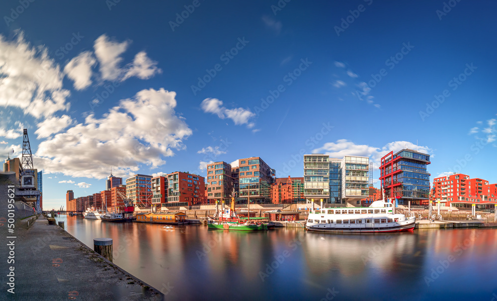 Hamburg view to the Sandtorhafen area with bricked wall buildings and sunlight with blue sky