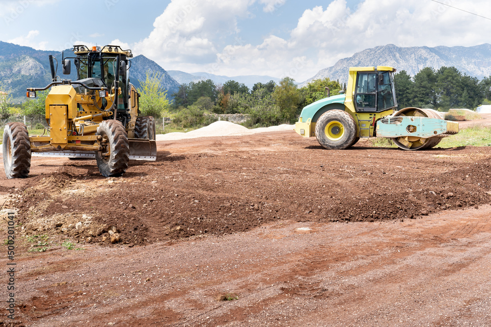 Grader Road Construction and Road compactor machinery. in excavation, vibratory road construction, earthworks and construction of new roads. Grader Road Construction and Road compactor machinery. in excavation, vibratory road construction, earthworks and construction of new roads.