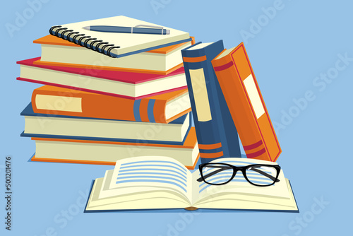A stack of books and notebooks, glasses