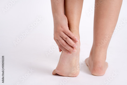 Massage of female feet. Pedicures. Isolated on white background. © PBXStudio