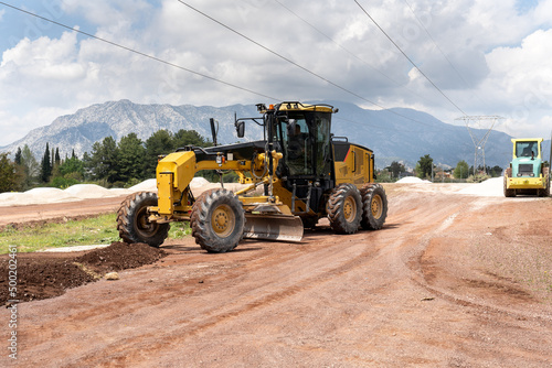 Grader Road Construction and Road compactor machinery. in excavation, vibratory road construction, earthworks and construction of new roads. 