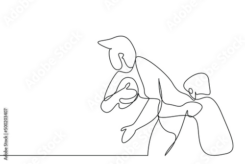 an athlete struggles to escape from his opponent with the ball in his hand.
