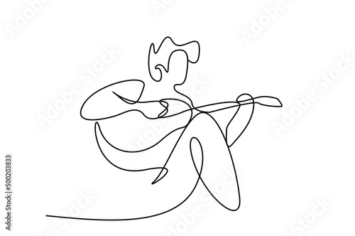 a young male sitting on his lap playing the guitar and having fun