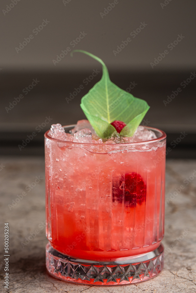 custom made wallpaper toronto digitalGlass with strawberry mojito cocktail with lemon and mint, cold refreshing drink or beverage with ice on gray background.