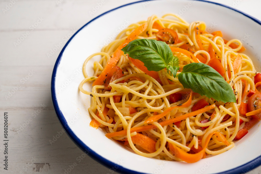 Spaghetti with carrot and vegetables. Traditional Italian recipe.