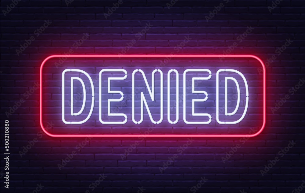 Denied neon sign on brick wall background Denied neon sign on brick wall background