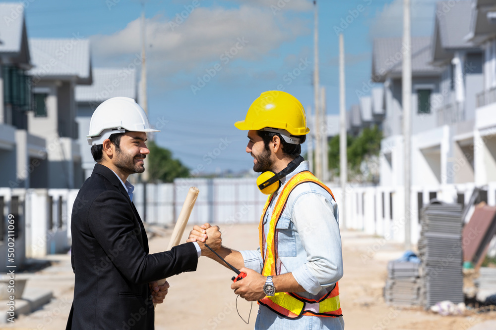 Engineer man handshake with businessman after finishing up meeting in construction site,Hand shake concept. Engineer man handshake with businessman after finishing up meeting in construction site,Hand shake concept.