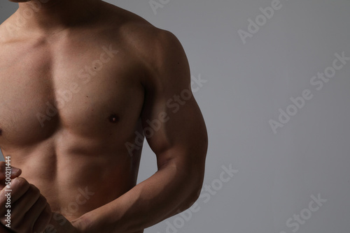 Strengthen your mind, strengthen your body. Cropped shot of male perfect body.