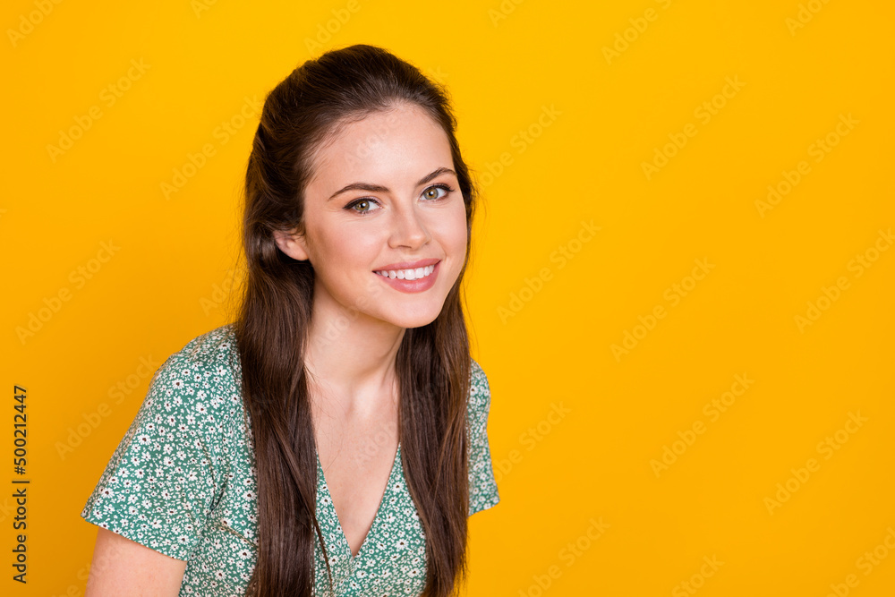 Photo of charming cute woman wear print dress smiling empty space isolated yellow color background