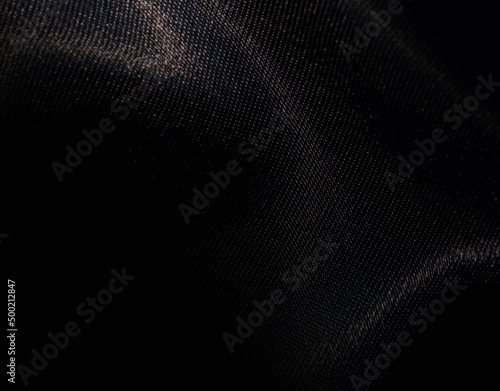 Foto Black shiny polyester fabric background for graphic design, banner, poster