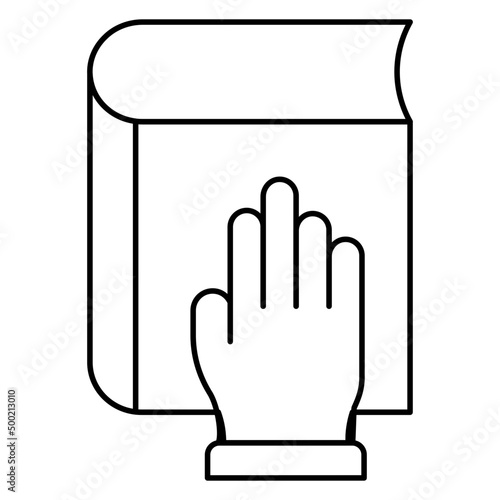 Hand on book denoting concept of oath