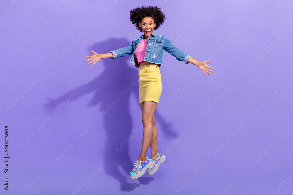 Full length body size view of attractive crazy fit cheery girl jumping hugging isolated over bright violet purple color background Full length body size view of attractive crazy fit cheery girl jumping hugging isolated over bright violet purple color background